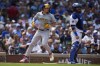 Milwaukee Brewers' Willy Adames jogs past Chicago Cubs catcher Tomás Nido to score on a single from Brice Turang during the sixth inning of a baseball game Wednesday, July 24, 2024, in Chicago. (AP Photo/Erin Hooley)