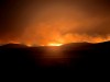In this photo provided by the Oregon Department of Transportation, the Durkee Fire lights up the sky in eastern Ore., Monday, July 22, 2024. (Oregon Department of Transportation via AP)