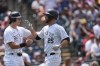 Colorado Rockies' Michael Toglia, left, congratulates Jacob Stallings as he crosses home plate after hitting a three-run home run off Boston Red Sox starting pitcher Nick Pivetta in the third inning of a baseball game Wednesday, July 24, 2024, in Denver. (AP Photo/David Zalubowski)
