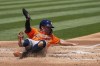 Houston Astros' Jose Altuve scores against the Oakland Athletics on Yainer Diaz's sacrifice fly during the first inning of a baseball game Wednesday, July 24, 2024, in Oakland, Calif. (AP Photo/Godofredo A. Vásquez)