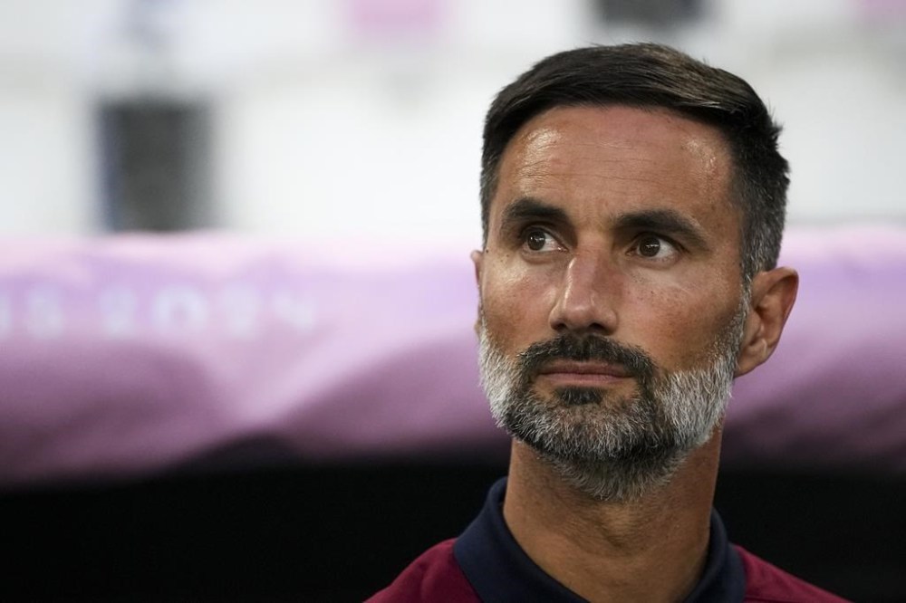 United States' head coach Marko Mitrovic looks on before the start of the men's Group A soccer match between France and the United States at the Velodrome stadium, during the 2024 Summer Olympics, Wednesday, July 24, 2024, in Marseille, France. (AP Photo/Daniel Cole)
