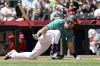 Seattle Mariners catcher Cal Raleigh takes a hard spin on a swing in the third inning against the Los Angeles Angels, Wednesday, July 24, 2024, in Seattle. (Kevin Clark/The Seattle Times via AP)