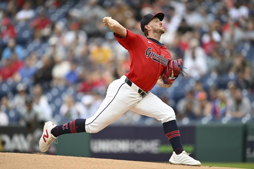 Cleveland Guardians starting pitcher Tanner Bibee delivers during the first inning of a baseball game against the Detroit Tigers, Wednesday, July 24, 2024, in Cleveland. (AP Photo/Nick Cammett)