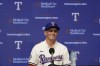 Texas Rangers first round draft pick catcher Malcolm Moore smiles during a news conference in Arlington, Texas, Wednesday, July 24, 2024. (AP Photo/LM Otero)