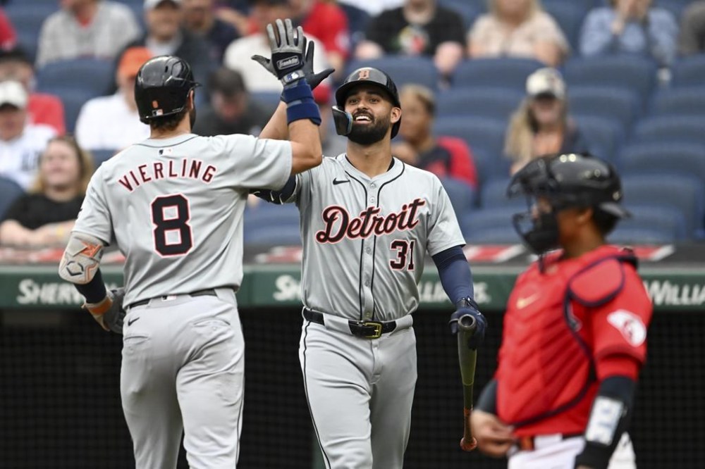 Detroit Tigers' Matt Vierling (8) and Riley Greene (31) celebrate a solo home run hit by Vierling during the first inning of a baseball game against the Cleveland Guardians, Wednesday, July 24, 2024, in Cleveland. (AP Photo/Nick Cammett)