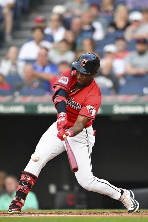Cleveland Guardians' Angel Martínez hits a single during the fourth inning of a baseball game against the Detroit Tigers, Wednesday, July 24, 2024, in Cleveland. (AP Photo/Nick Cammett)