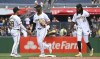 Pittsburgh Pirates' Nick Gonzales, left, Michael A. Taylor, middle, and Oneil Cruz, right, celebrate their team's win over the St. Louis Cardinals in a baseball game in Pittsburgh, Wednesday, July 24, 2024. (AP Photo/Justin Berl)