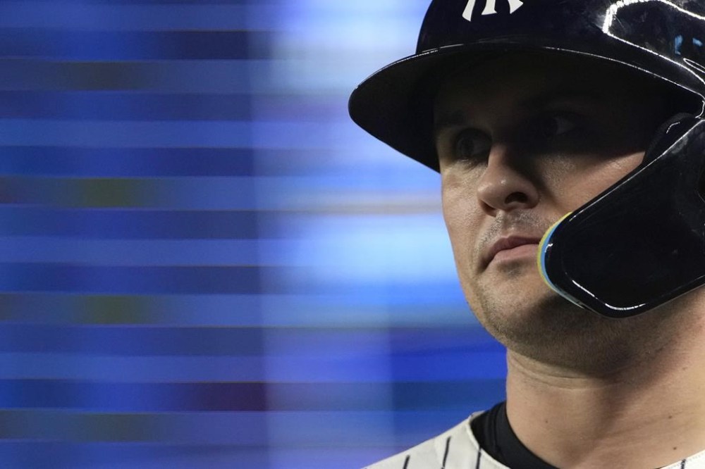 New York Yankees' J.D. Davis walks to the dugout during the eighth inning of a baseball game against the New York Mets, Wednesday, July 24, 2024, in New York. (AP Photo/Pamela Smith)