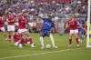 Chelsea defender Tosin Adarabioyo, center, moves the ball past Wrexham forward Ollie Palmer, left, during the first half of a club friendly soccer match on Wednesday, July 24, 2024 in Santa Clara, Calif. (AP Photo/Tony Avelar)