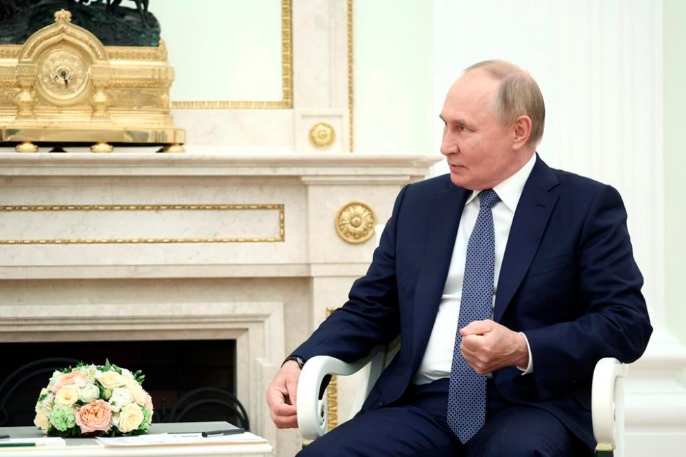 Russian President Vladimir Putin speaks with Syrian President Bashar Assad during their meeting in Moscow, Russia, Wednesday, July 24, 2024. (Valery Sharifulin, Sputnik, Kremlin Pool Photo via AP)