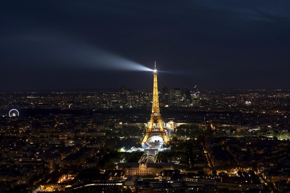 The Eiffel Tower is seen from the Montparnasse tower observation deck ahead of the 2024 Summer Olympics, Tuesday, July 23, 2024, in Paris. The Eiffel Tower, now fitted with 43-foot tall Olympic rings remains as much a draw for tourists as ever -- as long as they can find their way to it. THE CANADIAN PRESS/AP/David Goldman
