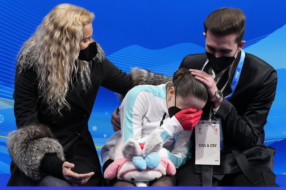 FILE - Kamila Valieva, of the Russian Olympic Committee, reacts after competing in the women's free skate program during the figure skating competition at the 2022 Winter Olympics, Thursday, Feb. 17, 2022, in Beijing.The United States figure skating team was formally confirmed as the 2022 Beijing Olympics champion by a sports court ruling. It opens the way to the skaters getting their medals at a presentation ceremony at the Paris Summer Games. (AP Photo/David J. Phillip, File)