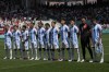 Argentina's starting players listen the national anthems prior to the Men's Group B soccer match between Argentina and Morocco at Geoffroy-Guichard Stadium during the 2024 Summer Olympics, Wednesday, July 24, 2024, in Saint-Etienne, France. (AP Photo/Silvia Izquierdo)