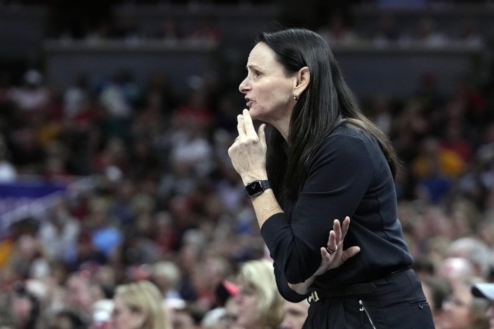 FILE - New York Liberty head coach Sandy Brondello watches during the second half of a WNBA basketball game against the Indiana Fever, Saturday, July 6, 2024, in Indianapolis. Brondello said Thursday, July 25, 2024 it will be hard to replace forward Bec Allen, who also plays in the WNBA for the Phoenix Mercury. The Opals announced that Allen will miss what would have been her second Olympics after tests revealed a high grade hamstring injury suffered in the Opals' final warm-up for the Paris Games. (AP Photo/Darron Cummings, File)