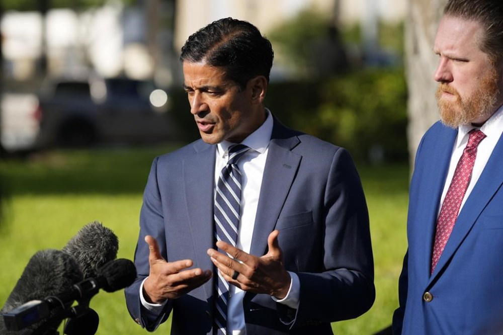 Nico LaHood left, attorney for former Uvalde Consolidated Independent School District police officer Adrian Gonzales, speaks with the media outside the Uvalde County Courthouse after Gonzales pleaded not guilty during a court appearance., Thursday, July 25, 2024, in Uvalde, Texas. (AP Photo/Eric Gay)