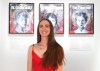 Canadian speedskater Brooklyn McDougall poses with her art on display as part of the Olympian Art exhibition at the Palais de Tokyo during the Olympic Games in Paris, France, Thursday, July 25, 2024. THE CANADIAN PRESS/Christinne Muschi