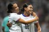 United States' Mallory Swanson, left, reacts with teammate Sophia Smith after scoring her side's third goal during a women's group B match between the United States and Zambia at Nice Stadium at the 2024 Summer Olympics, Thursday, July 25, 2024, in Nice, France. (AP Photo/Julio Cortez)
