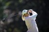 Lauren Coughlin, of USA, plays on the fourth hole during the last round of the Evian Championship women's golf tournament, in Evian, eastern France, Sunday, July 14, 2024. (AP Photo/Laurent Cipriani)