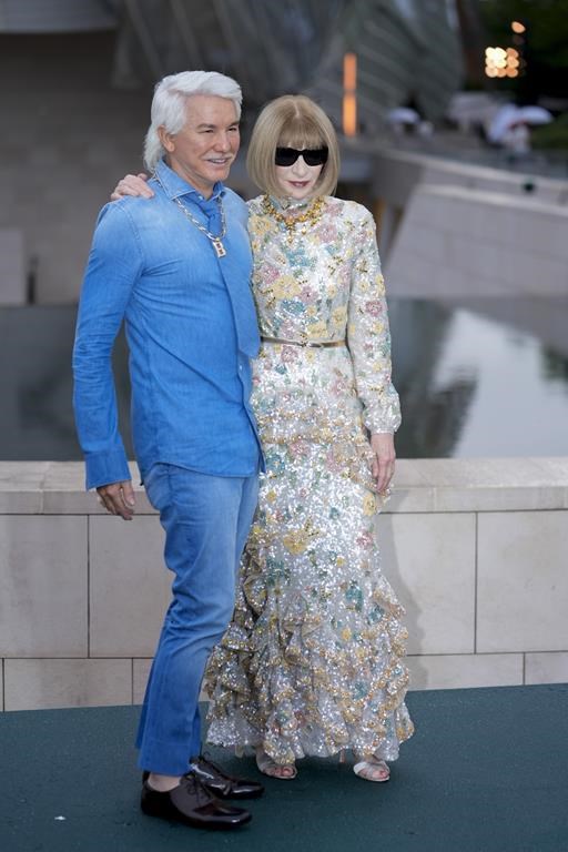 Baz Luhrmann, left, and Anna Wintour upon arrival at the Louis Vuitton Foundation on the eve of Paris Olympics opening ceremony, at the 2024 Summer Olympics, Thursday, July 25, 2024, in Paris, France. (AP Photo/Rebecca Blackwell)