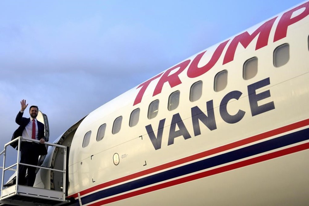 FILE - Republican vice presidential candidate Sen. JD Vance, R-Ohio, waves as he boards Trump Force Two, July 22, 2024, in Roanoke, Va. Vance introduced himself to the world in 2016, when he published his bestselling memoir,