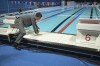 French Prime Minister Gabriel Attal touches the water at the swimming pool for Olympic competitions, at the Paris La Defense Arena in Nanterre, outside Paris, Monday July 5, 2024. The Paris La Defense Arena will host the swimming and some water polo events during the Paris 2024 Olympic Games. (Bertrand Guay/ Pool via AP)