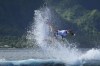 John John Florence, of the United States, surfs on a training day ahead of the 2024 Summer Olympics surfing competition Thursday, July 25, 2024, in Teahupo'o, Tahiti. (AP Photo/Gregory Bull)