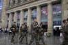 Soldiers patrol outside Gare du Nord train station at the 2024 Summer Olympics, Friday, July 26, 2024, in Paris, France. Hours away from the grand opening ceremony of the Olympics, high-speed rail traffic to the French capital was severely disrupted on Friday by what officials described as 