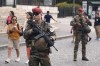 French soldiers stand guard at Sacre-Coeur of Montmartre Basilica during the 2024 Summer Olympics, Thursday, July 25, 2024, in Paris, France. (AP Photo/Dita Alangkara)