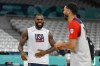 LeBron James, jokes with Jayson Tatum, as the United State's men's team practiced before the start of the basketball competition at the 2024 Summer Olympics, Wednesday, July 24, 2024 in Villeneuve-d'Ascq, France. (AP Photo/Michael Conroy)