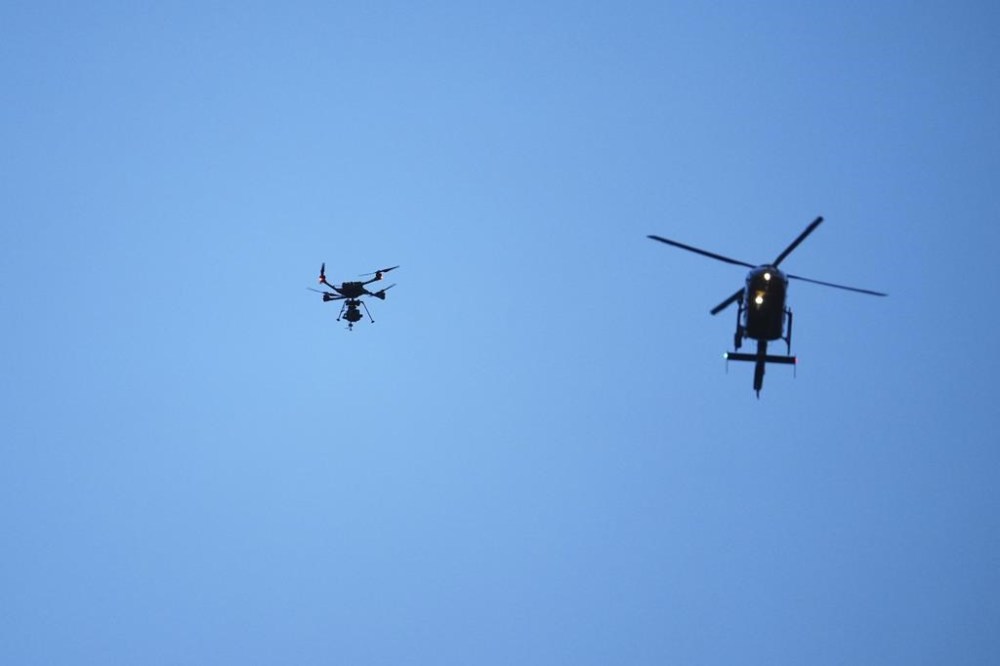 Dirty tricks are nothing new in world football. Rivals have long looked to give themselves a competitive advantage or to unsettle the opposition. A helicopter, right, and a drone fly above the Anfield stadium before the English Premier League soccer match between Liverpool and Manchester United in Liverpool, England, Sunday, Dec.17, 2023. THE CANADIAN PRESS/AP/Jon Super