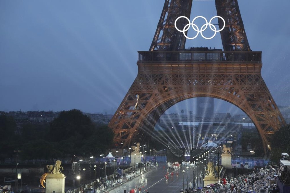 Delegations arrive on the Iena Bridge, in Paris, France, during the opening ceremony of the 2024 Summer Olympics, Friday, July 26, 2024. (Ludovic Marin/Pool Photo via AP)