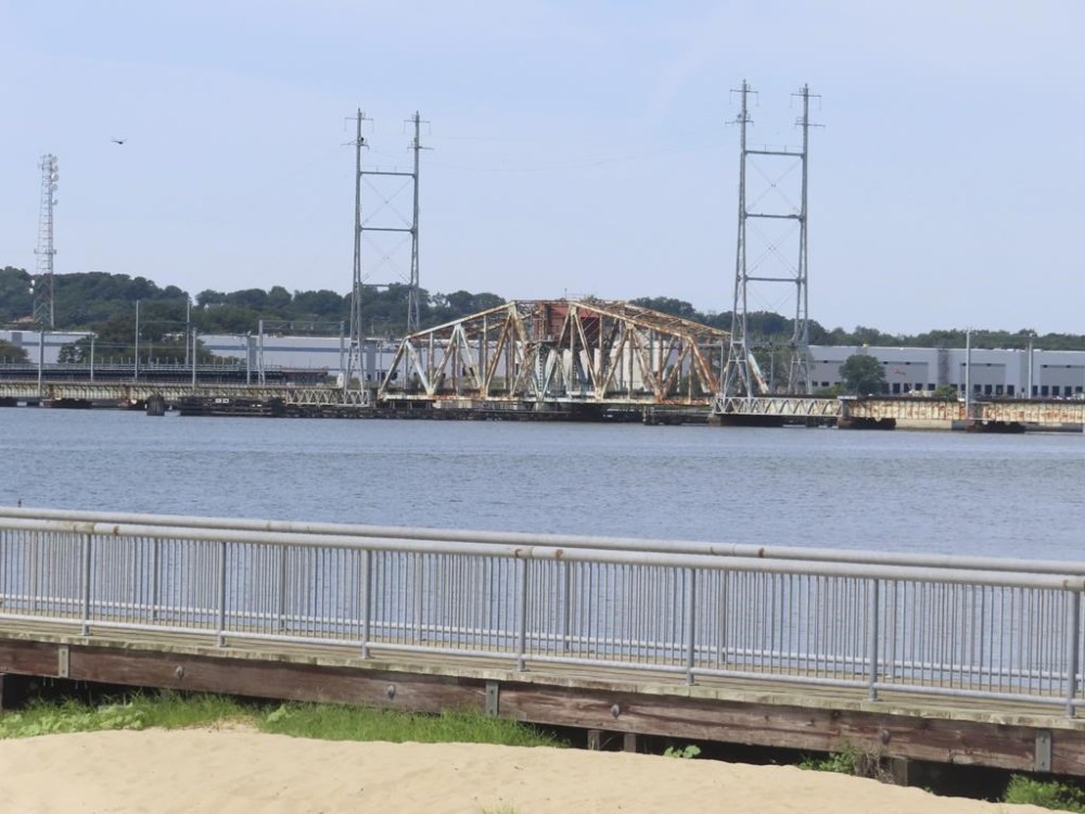 The industrialized waterfront of Perth Amboy, N.J., is shown on Friday, July 26, 2024, the same day it was announced that the federal government is giving $575 million in funding for 19 climate resiliency projects across the country, many of them designed to use nature-based elements including plants, rain gardens and absorbent paving materials to help address flooding and other weather-related disasters. (AP Photo/Wayne Parry)