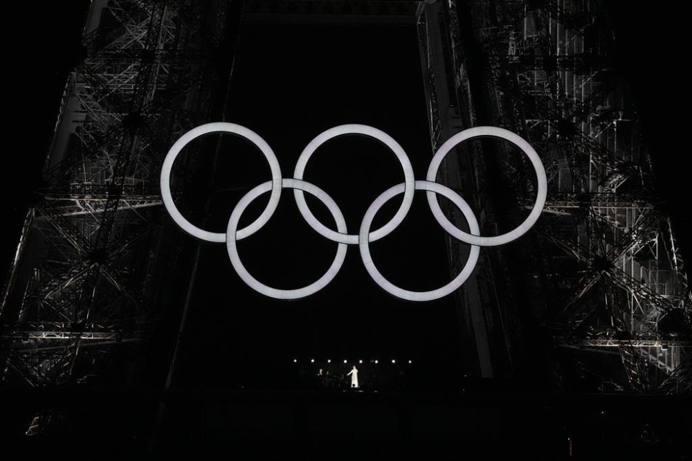 Celine Dion sings from Eiffel Tower during opening ceremony for the 2024 Summer Olympics in Paris on Friday, July 26, 2024. THE CANADIAN PRESS/Christinne Muschi