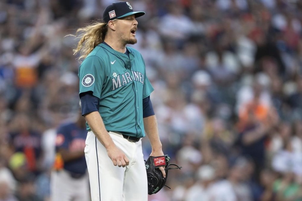 Seattle Mariners relief pitcher Ryne Stanek reacts after giving up a two-run home run during the seventh inning of a baseball game against the Houston Astros, Saturday, July 20, 2024, in Seattle. (AP Photo/Stephen Brashear)