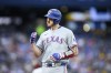 Texas Rangers' Jonah Heim (28) celebrates his two-run RBI single during third inning MLB baseball action against the Toronto Blue Jays, in Toronto, on Friday, July 26, 2024. THE CANADIAN PRESS/Christopher Katsarov