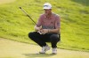 Taylor Pendrith lines up his putt on the 18th green during the second round of the 3M Open golf tournament at the Tournament Players Club, Friday, July 26, 2024, in Blaine, Minn. (AP Photo/Charlie Neibergall)
