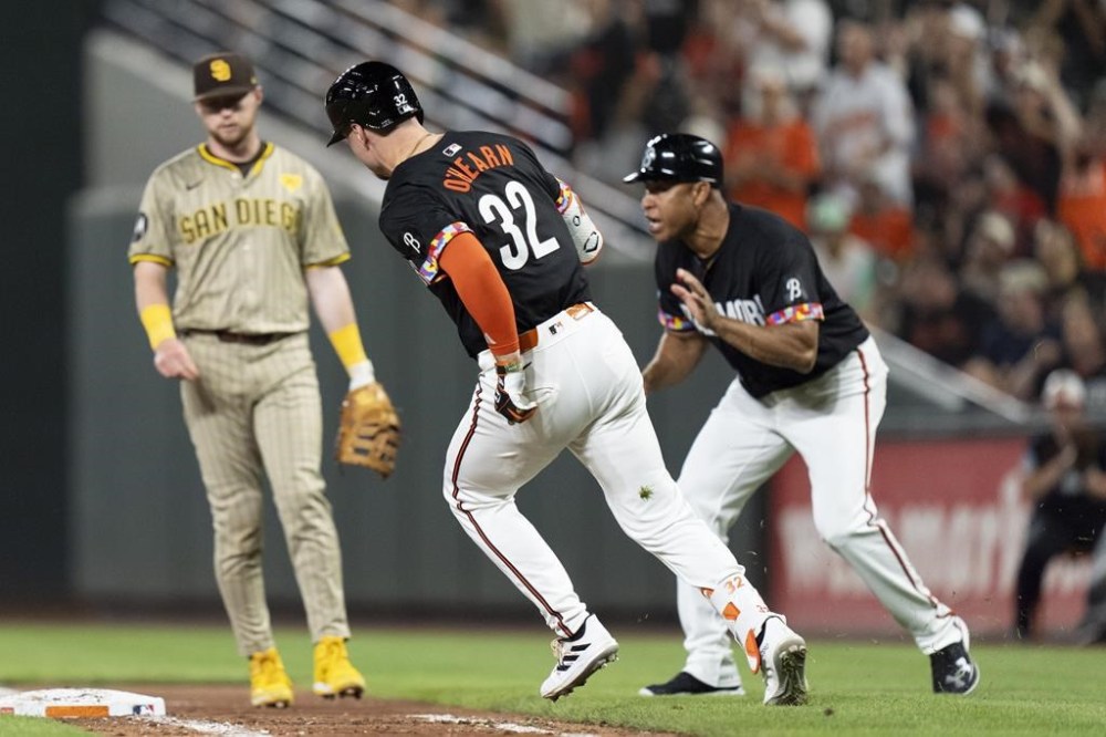 Baltimore Orioles' Ryan O'Hearn (32) advances toward first base after hitting a double during the eighth inning of a baseball game against the San Diego Padres, Friday, July 26, 2024, in Baltimore. (AP Photo/Stephanie Scarbrough)