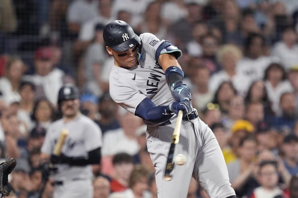 New York Yankees' Aaron Judge hits a three-run home run during the seventh inning of a baseball game against the Boston Red Sox, Friday, July 26, 2024, in Boston. (AP Photo/Michael Dwyer)