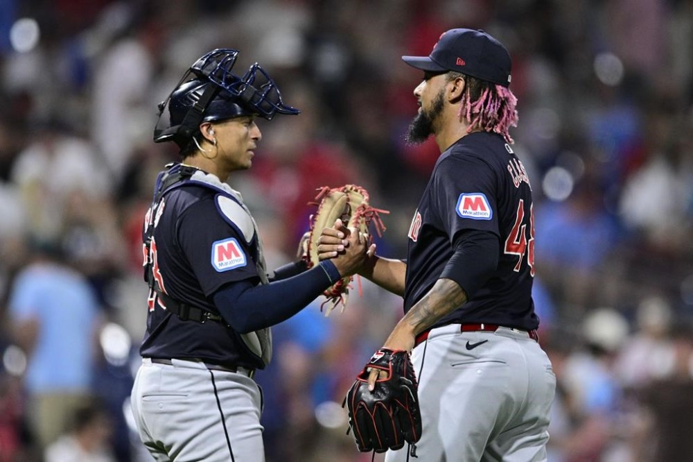 Cleveland Guardians' Emmanuel Clase, right, and Bo Naylor, left, celebrate after their victory over the Philadelphia Phillies, Friday, July 26, 2024, in Philadelphia. (AP Photo/Derik Hamilton)