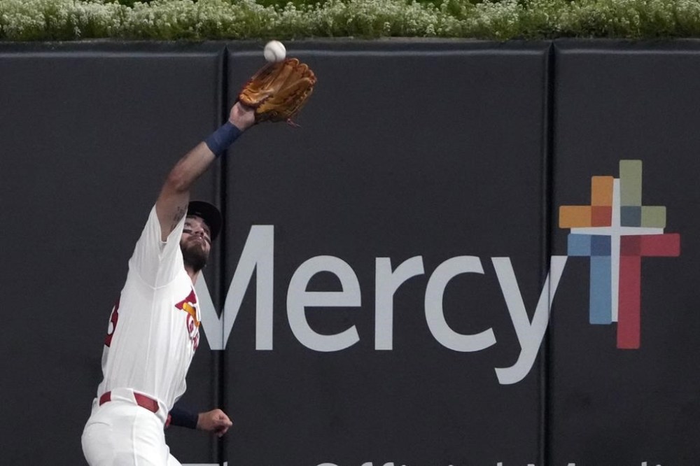 St. Louis Cardinals center fielder Michael Siani catches a fly ball by Washington Nationals' Lane Thomas during the fifth inning of a baseball game Friday, July 26, 2024, in St. Louis. (AP Photo/Jeff Roberson)
