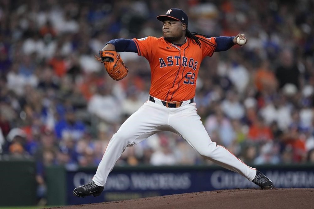Houston Astros starting pitcher Framber Valdez delivers during the first inning of a baseball game against the Los Angeles Dodgers, Friday, July 26, 2024, in Houston. (AP Photo/Kevin M. Cox)