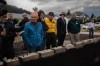 Jasper Mayor Richard Ireland, second left in blue, looks at what is left of his home of 67 years with federal Minister of Emergency Preparedness Harjit Sajjan, left to right, & Premier Danielle Smith, and Minister of Forestry and Parks Todd Loewen in Jasper, Alta., on Friday, July 26, 2024. THE CANADIAN PRESS/Amber Bracken