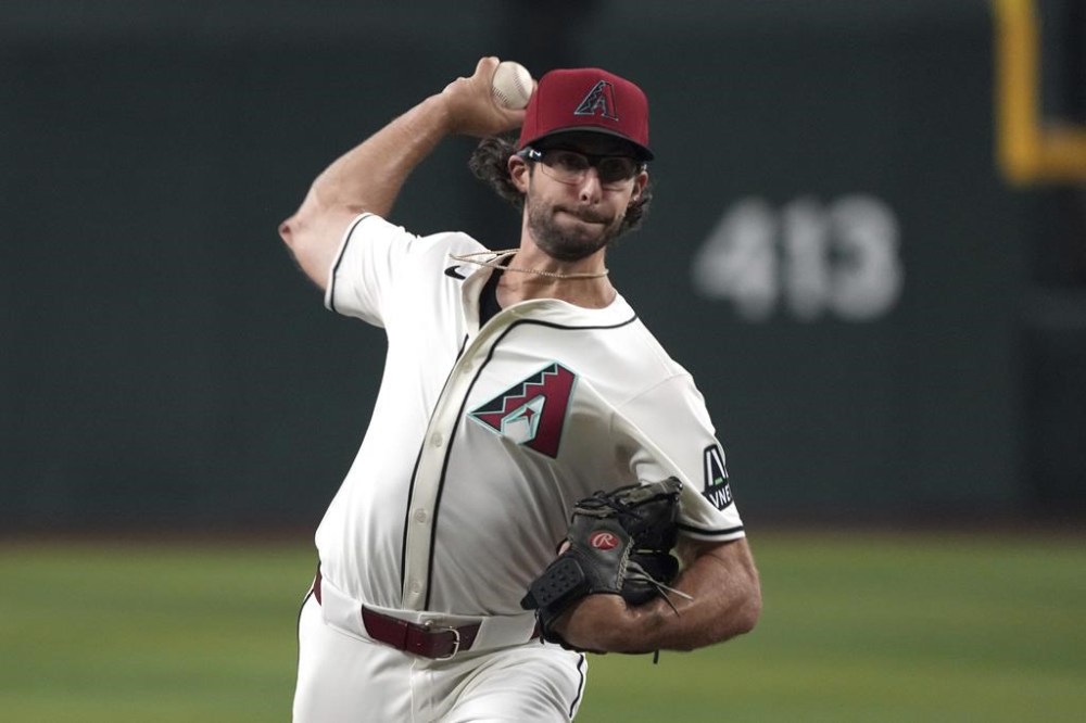 Arizona Diamondbacks pitcher Zac Gallen throws against the Pittsburgh Pirates in the first inning during a baseball game, Friday, July 26, 2024, in Phoenix. (AP Photo/Rick Scuteri)