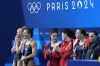 United States' Sarah Bacon and Kassidy Cook celebrate after winning the silver medal flanked by gold medal China's Chen Yiwen and Chang Yani and bronze medal Britain's Yasmin Harper and Scarlett Mew Jensen in the women's synchronised 3m springboard diving final at the 2024 Summer Olympics, Saturday, July 27, 2024, in Saint-Denis, France. (AP Photo/Lee Jin-man)