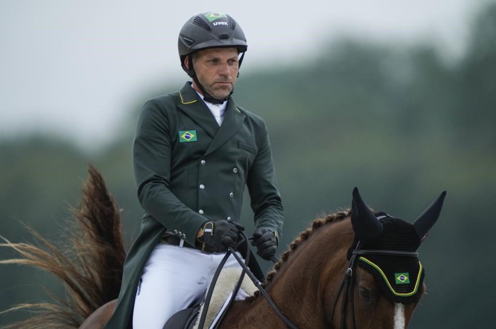 Brazil's Carlos Parros and his horse Safira during the Equestrian Eventing Dressage competition, at the 2024 Summer Olympics, Saturday, July 27, 2024, in Versailles, France. (AP Photo/Mosa'ab Elshamy)