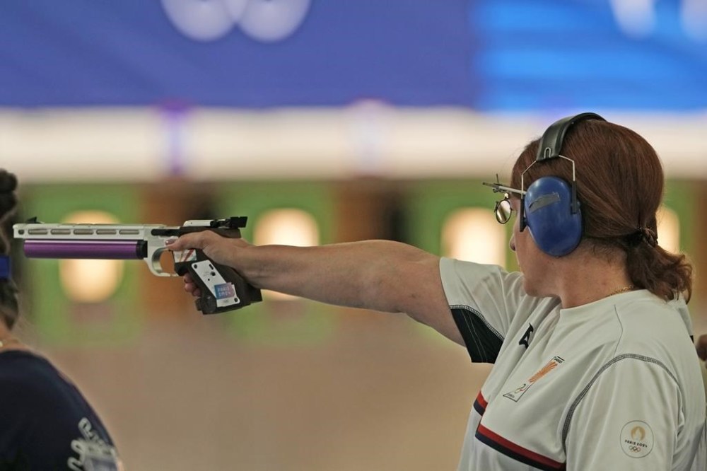 Georgia's Nino Salukvadze competes in the 10m air pistol women's qualification round at the 2024 Summer Olympics, Saturday, July 27, 2024, in Chateauroux, France. (AP Photo/Manish Swarup)