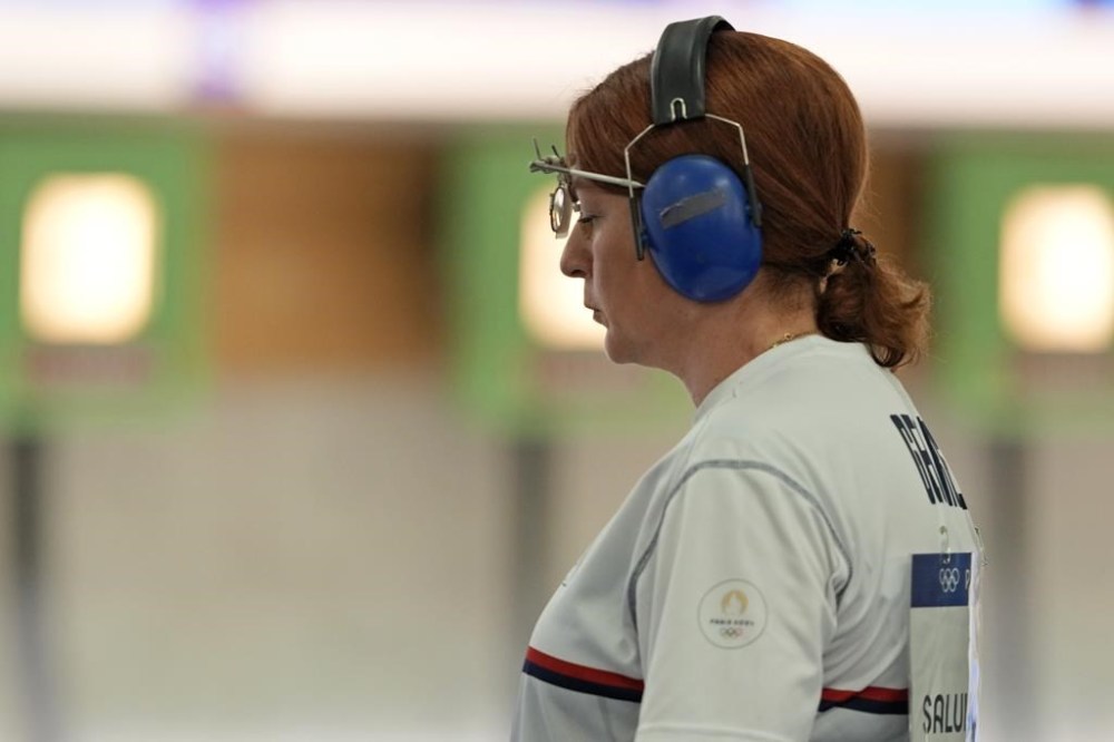 Georgia's Nino Salukvadze gestures during the 10m air pistol women's qualification round at the 2024 Summer Olympics, Saturday, July 27, 2024, in Chateauroux, France. (AP Photo/Manish Swarup)