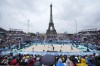 Sweden and Australia compete in men's beach volleyball at Eiffel Tower Stadium at the 2024 Summer Olympics, Saturday, July 27, 2024, in Paris, France. (AP Photo/Robert F. Bukaty)