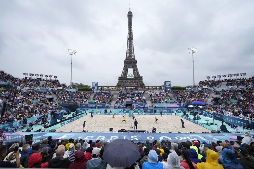 Sweden and Australia compete in men's beach volleyball at Eiffel Tower Stadium at the 2024 Summer Olympics, Saturday, July 27, 2024, in Paris, France. (AP Photo/Robert F. Bukaty)