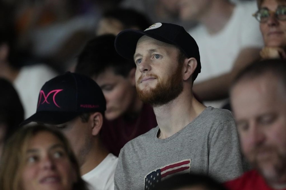 Pat Woepse, center, husband of the U.S. player Maddie Musselman, watches a match during a women's Water Polo Group B preliminary match between USA and Greece at the 2024 Summer Olympics, Saturday, July 27, 2024, in Saint-Denis, France. (AP Photo/Lee Jin-man)